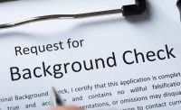 High Angle View Of Criminal Background Check Application Form With Pen for the TREC background check